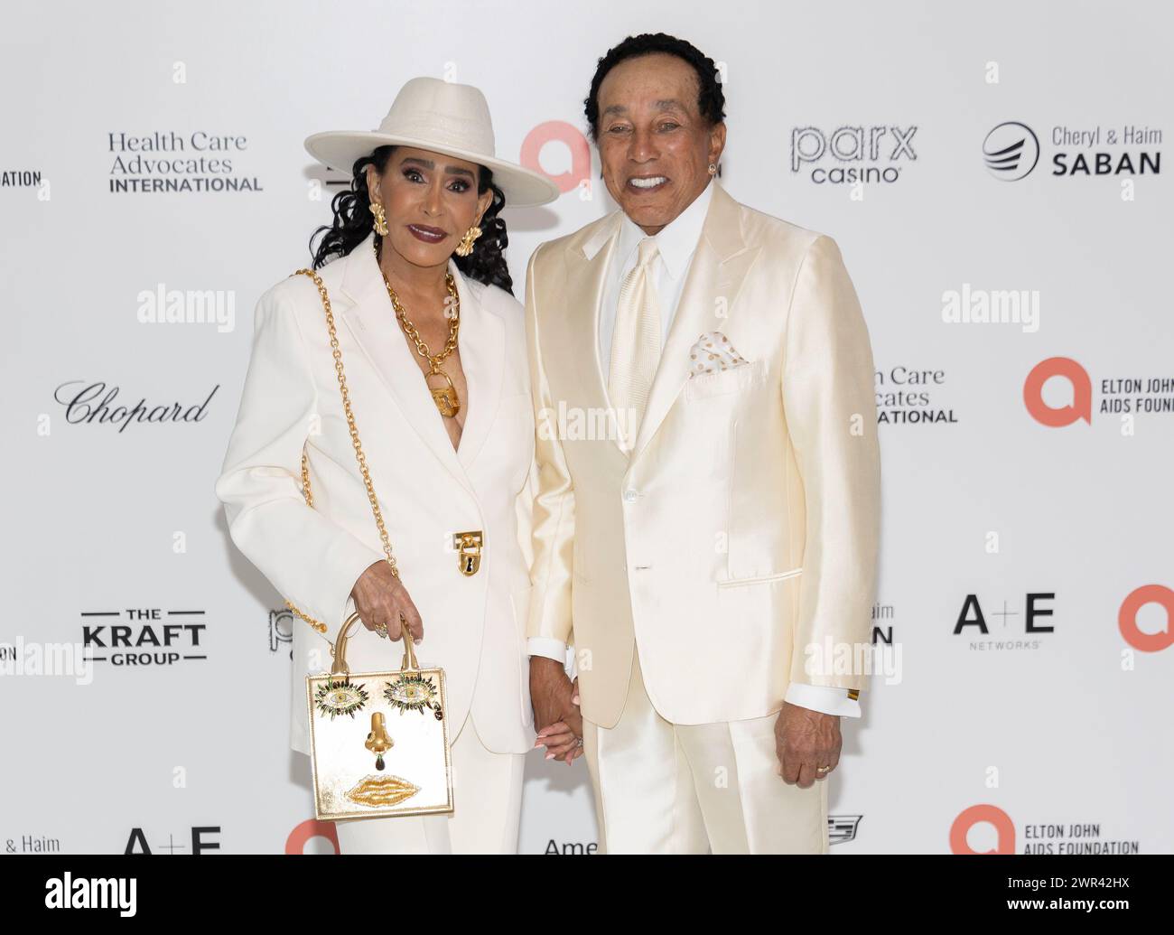 West Hollywood, USA. 10th Mar, 2024. Claudette Rogers and Smokey Robinson attend the arrivals of the 32nd Annual Elton John AIDS Foundation Academy Awards Viewing Party at The City of West Hollywood Park in West Hollywood, CA on March 10, 2024. (Photo by Corine Solberg/SipaUSA) Credit: Sipa USA/Alamy Live News Stock Photo