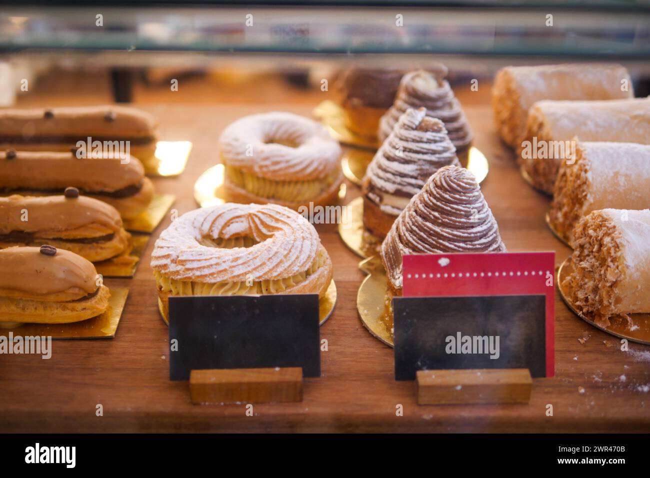 An array of baked goods, including pastries, is showcased in the bakery ...