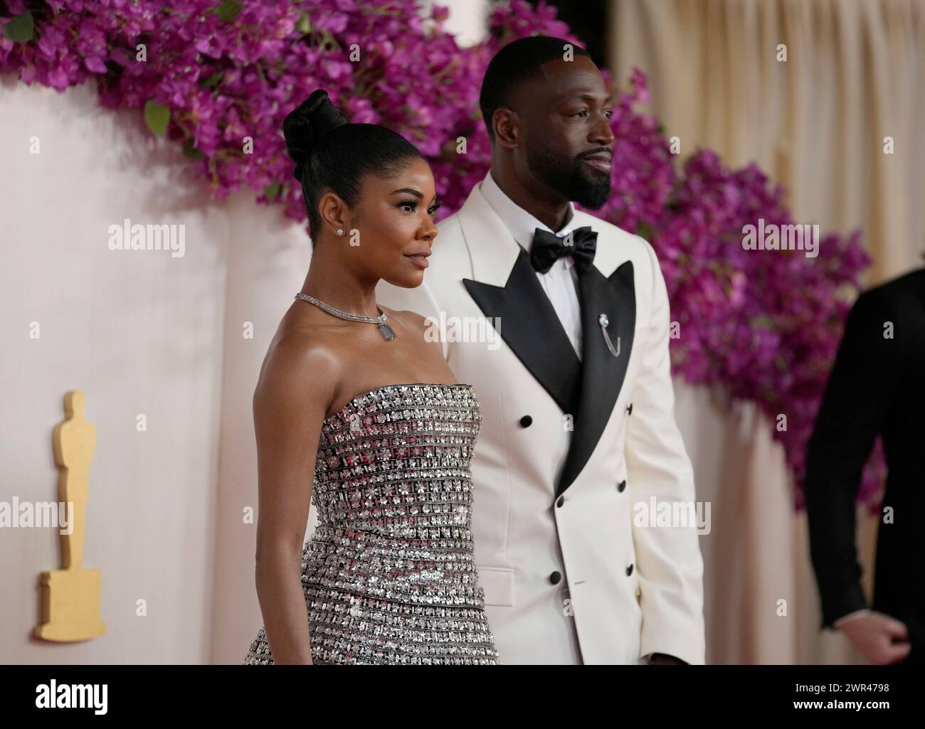 Gabrielle Union, left, and Dwyane Wade arrive at the Oscars on Sunday(02)