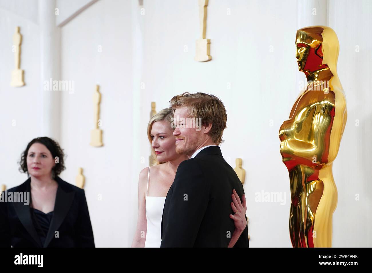 Kirsten Dunst, from left and Jesse Plemons arrive at the Oscars on