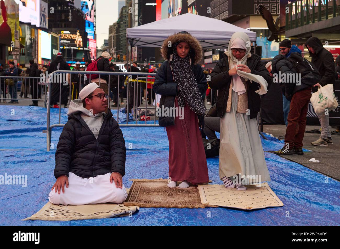 New York, New York, USA. 10th Mar, 2024. Three children lay down rugs
