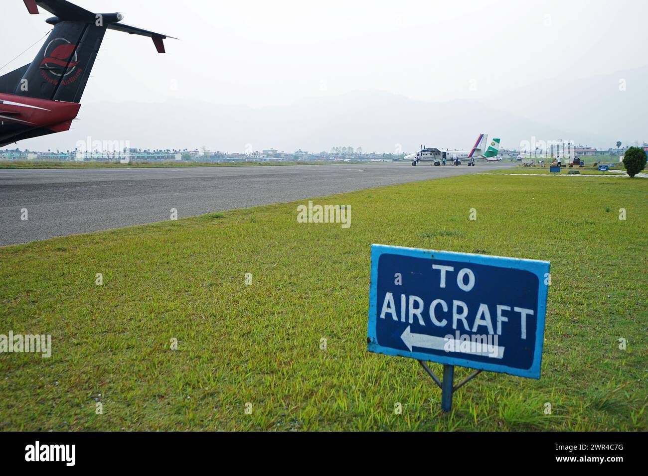 'To Aircraft' sign board at Pokhara international airport- Nepal Stock Photo