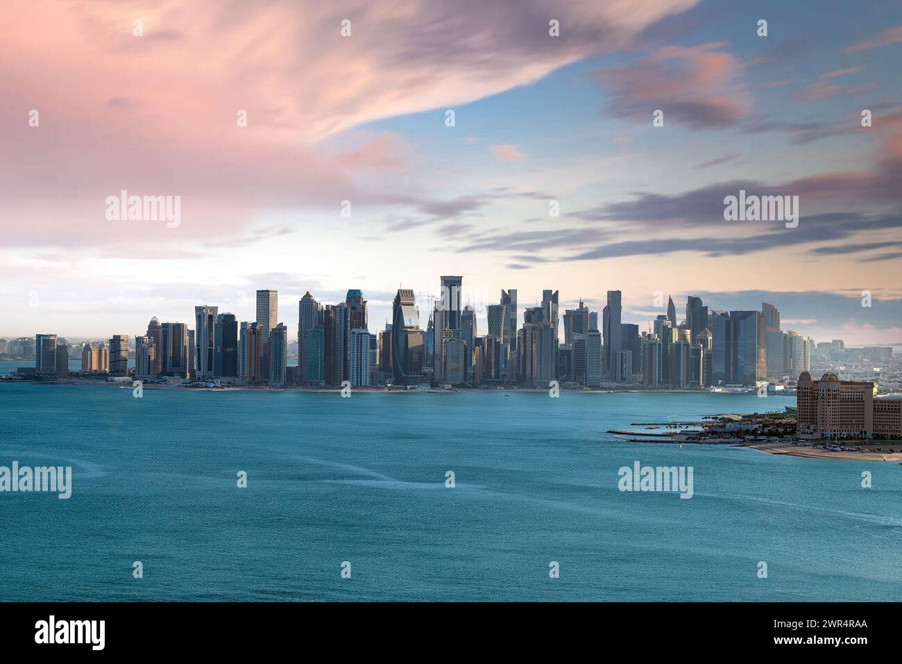 The skyline of Doha, Qatar during sunset Stock Photo - Alamy