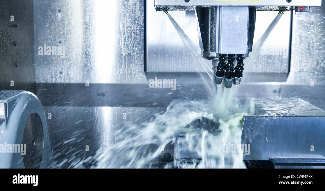 Metalworking CNC milling machine. Cutting metal modern processing Hi-technology machining concept. Stock Photo