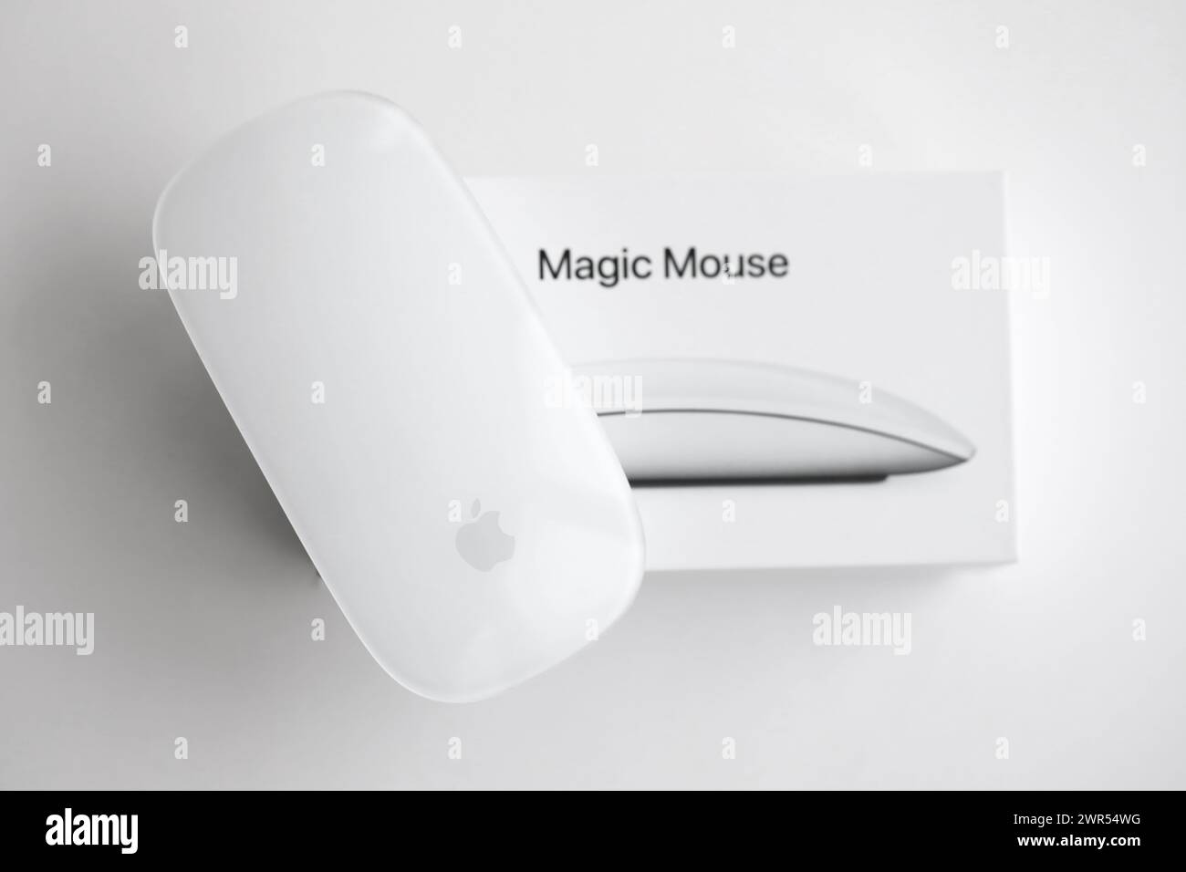 KYIV, UKRAINE - NOVEMBER 27, 2023 Apple Magic Mouse 3rd generation lies on white background close up Stock Photo