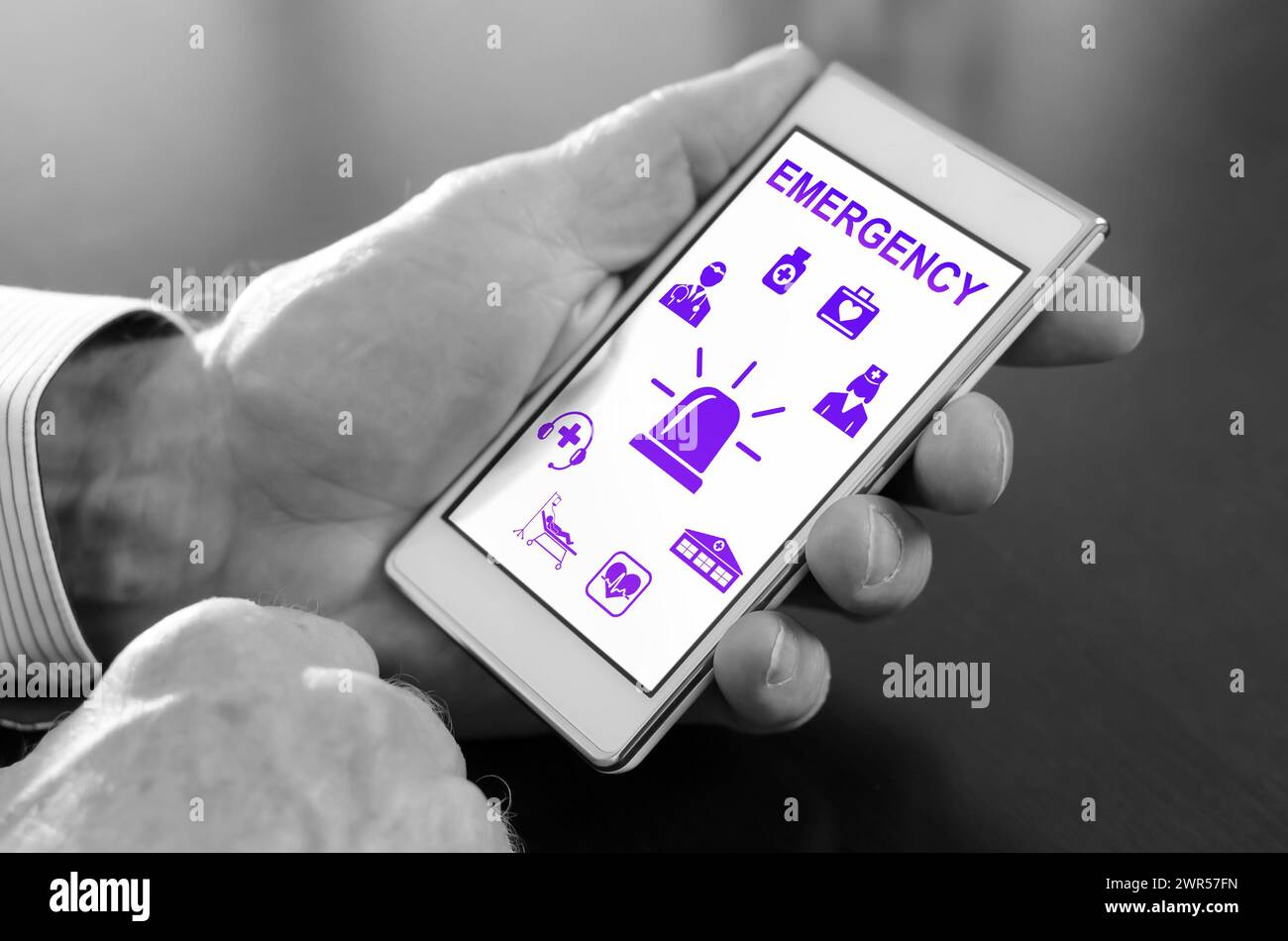 Hand holding a smartphone with emergency concept Stock Photo - Alamy