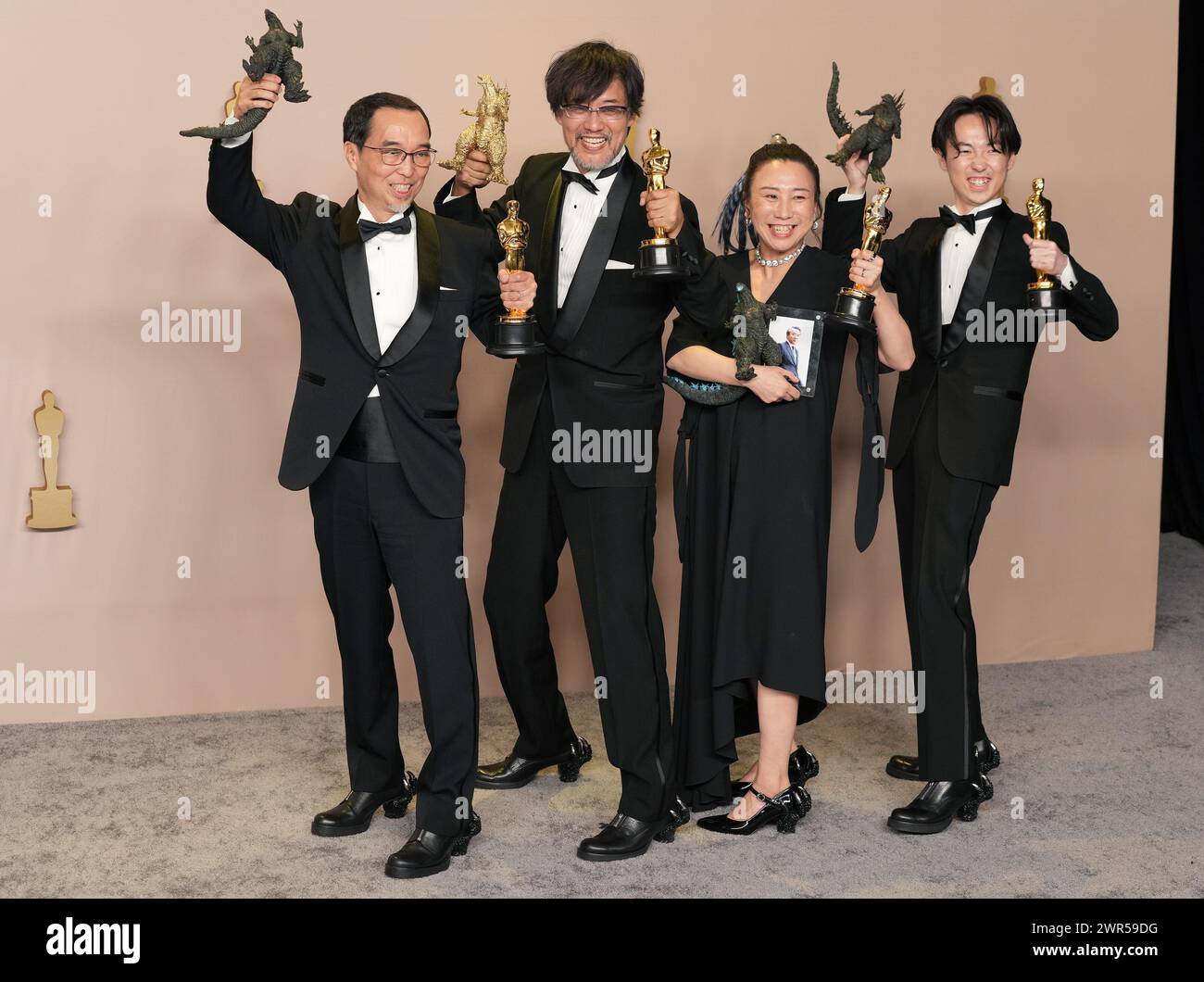 Los Angeles, USA. 10th Mar, 2024. (L-R) Masaki Takahashi, Takashi Yamazaki, Kiyoko Shibuya and Tatsuji Nojima, winners of the Best Visual Effects award for “Godzilla Minus One”, pose in the press room at the The 96th Academy Awards held by the Academy of Motion Picture Arts and Sciences at the Dolby Theatre in Los Angeles, CA on Sunday, March 10, 2024. (Photo by Sthanlee B. Mirador/Sipa USA) Credit: Sipa USA/Alamy Live News Stock Photo