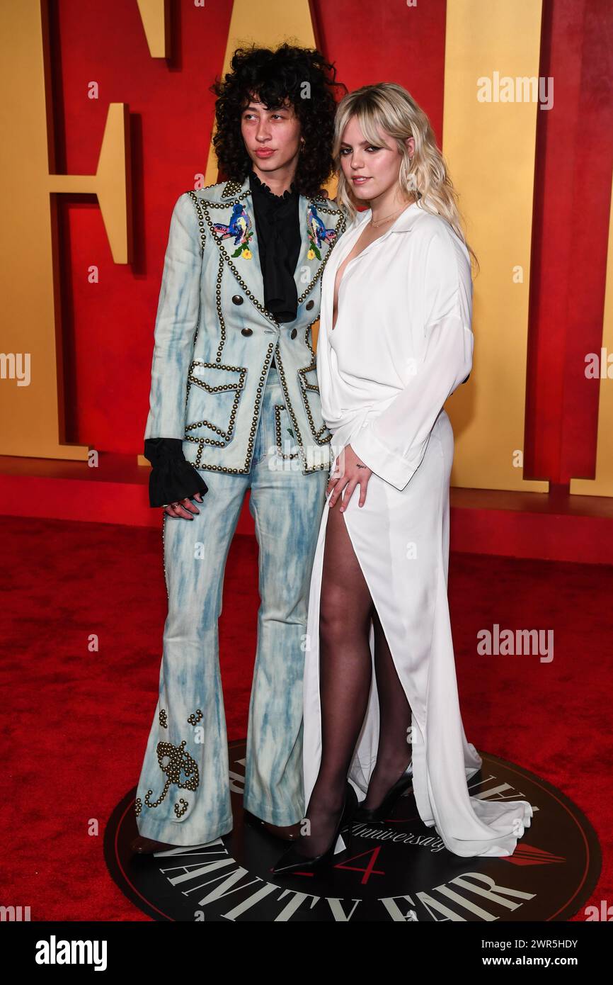 USA. 10th Mar, 2024. Towa Bird and Renee Rapp walking on the red carpet at the 2024 Vanity Fair Oscar Party held at the Wallis Annenberg Center for the Performing Arts in Beverly Hills, CA on March 10, 2024. (Photo by Anthony Behar/Sipa USA) Credit: Sipa USA/Alamy Live News Stock Photo