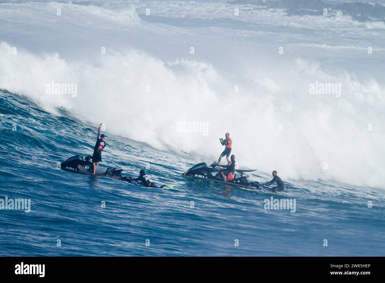 Surfing at the Eddie Aikau big wave surfing contest, at Waimea Bay, on the north shore of Oahu, Hawaii, 12-08 Stock Photo