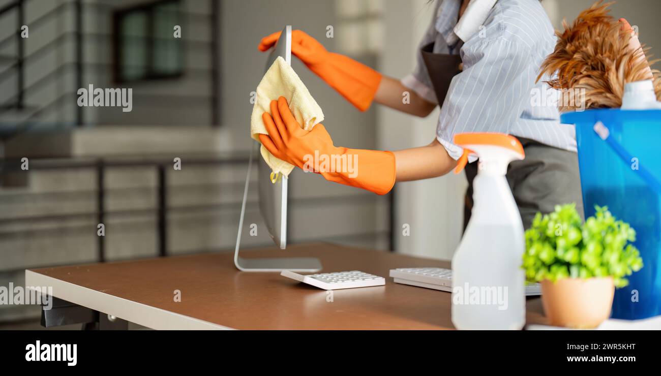 Woman clean in office room at office. Housekeeper or maid cleaner feel ...