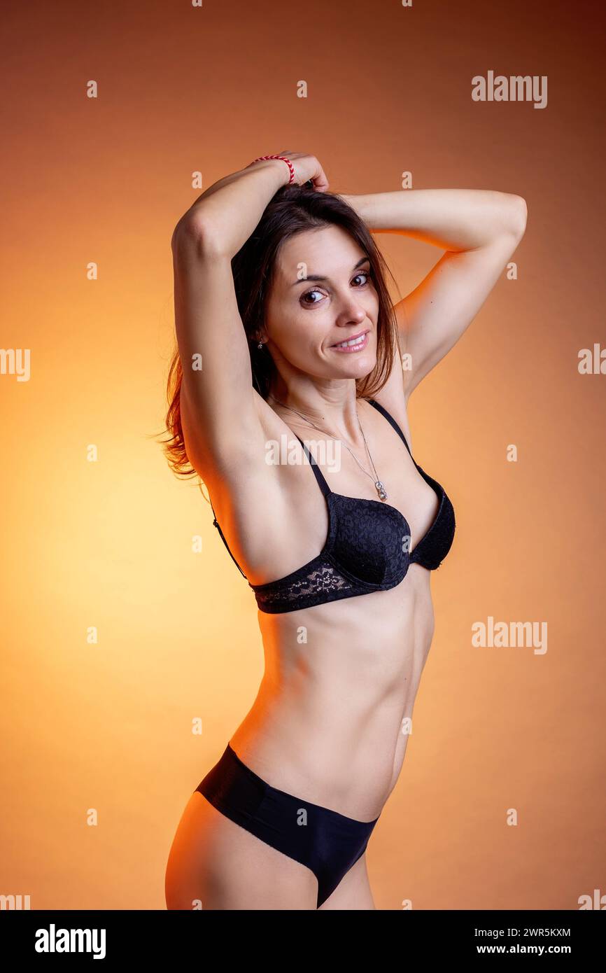 Portrait of a smiling middle aged caucasian woman in studio Stock Photo