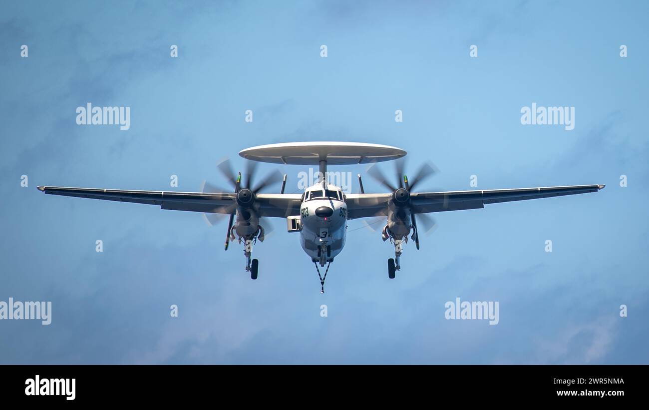 SOUTH CHINA SEA (March 5, 2024) A E-2D Hawkeye, assigned to the “Liberty Bells” of Carrier Airborne Early Warning Squadron (VAW) 115, prepares to land Stock Photo