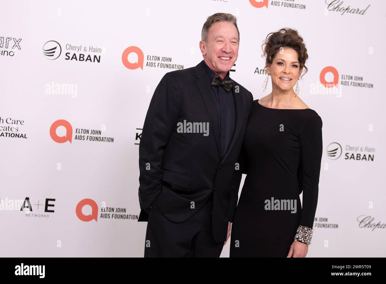 Tim Allen and Jane Hajduk attend the arrivals of the 32nd Annual Elton John AIDS Foundation Academy Awards Viewing Party at The City of West Hollywood Park in West Hollywood, CA on March 10, 2024. (Photo by Corine Solberg/SipaUSA) Stock Photo