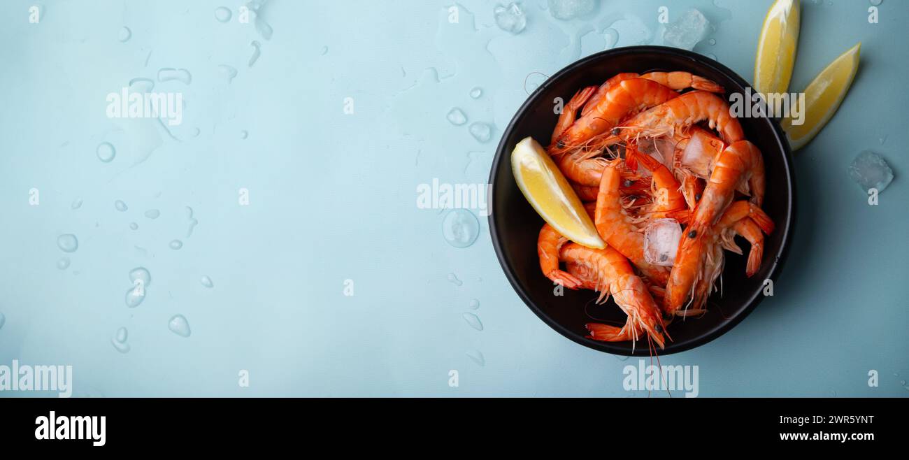 Defrosted shrimps in a bowl. Sea and ocean iced fish. Fish supermarket concept. Stock Photo