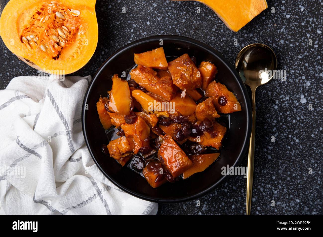 Autumn Delight - Roasted Pumpkin with Cranberries and Spices. Stock Photo