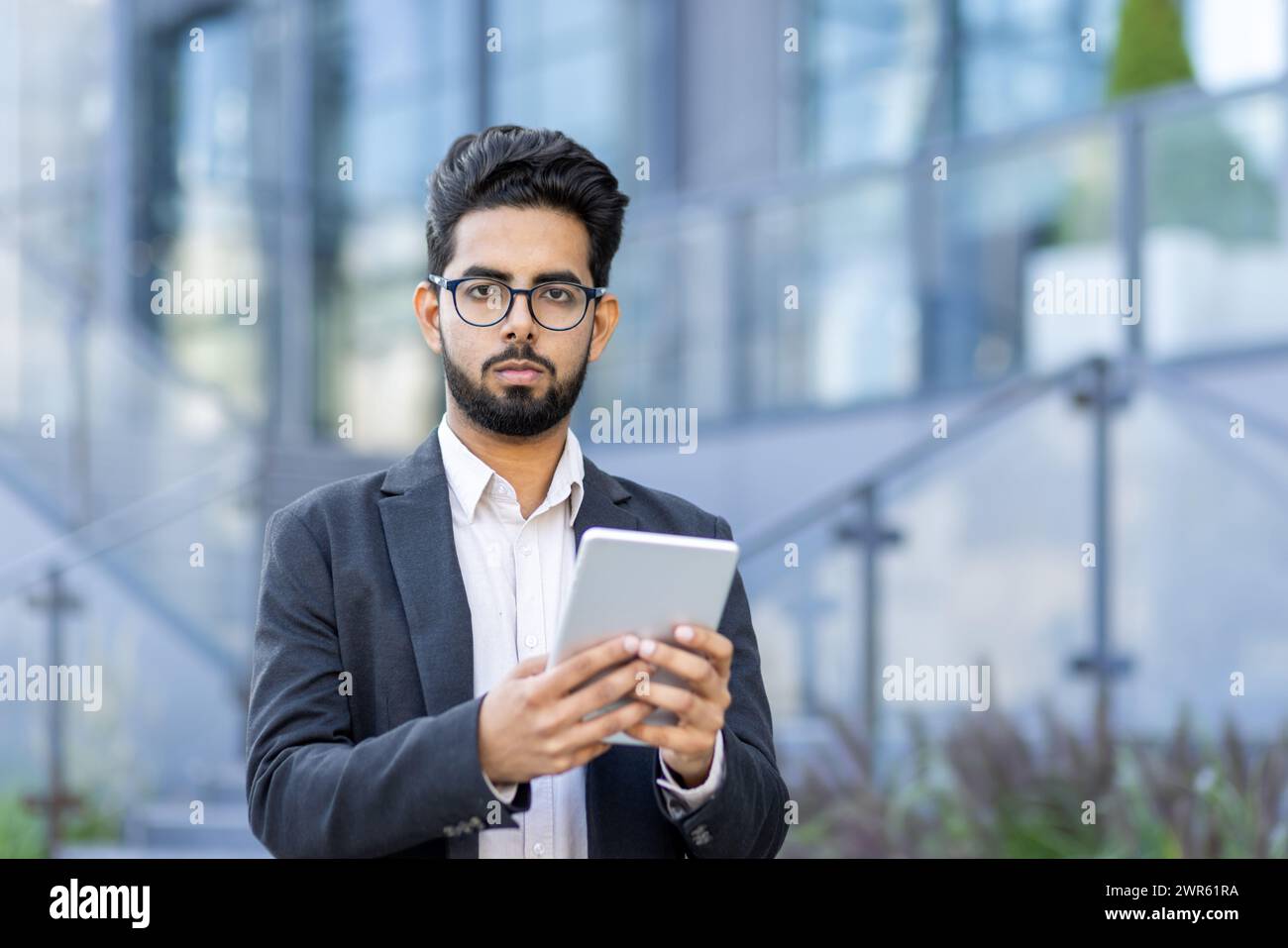 Indian man standing confidently hi-res stock photography and images - Alamy