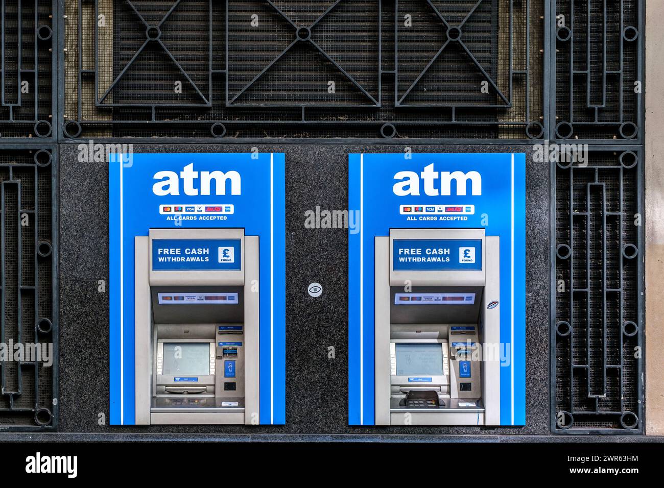 City of Westminster, London UK, March 08 2024, Two ATM Cash Point Withdrawal Machines With No People Stock Photo