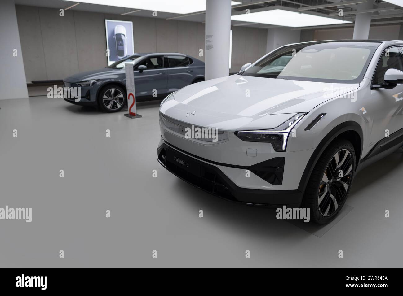 Polestar 2 car model in Studio, Volvo’s EV subsidiary, grey electric passenger vehicle in exhibition hall, alternative energy development, High Tech T Stock Photo