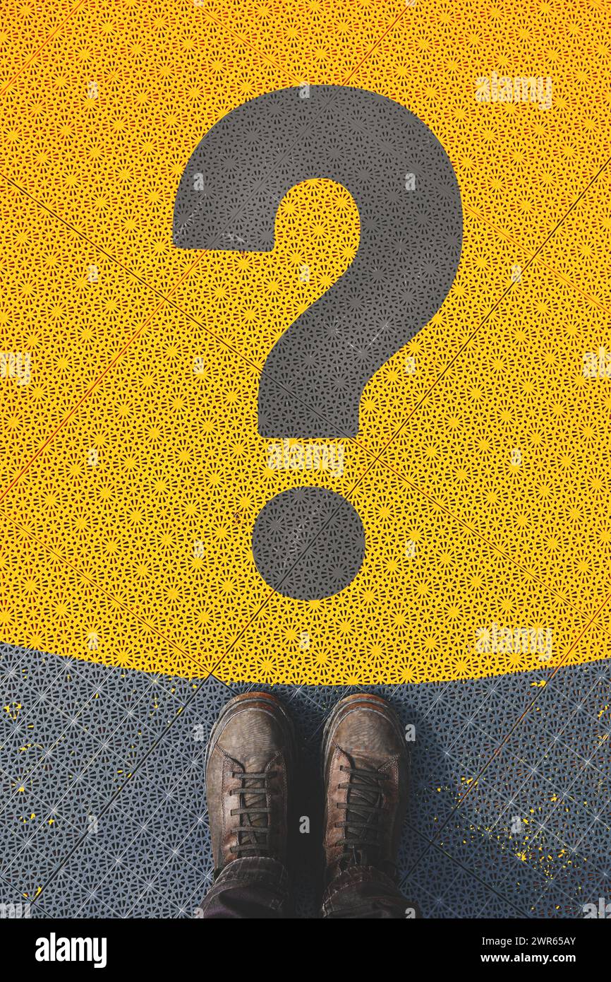 Questioning and reflective personality concept, man standing over large question mark symbol on non slip plastic flooring, top view Stock Photo