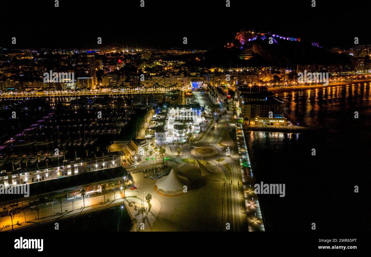 An aerial night view of the illuminated Alicante cityscape Stock Photo ...