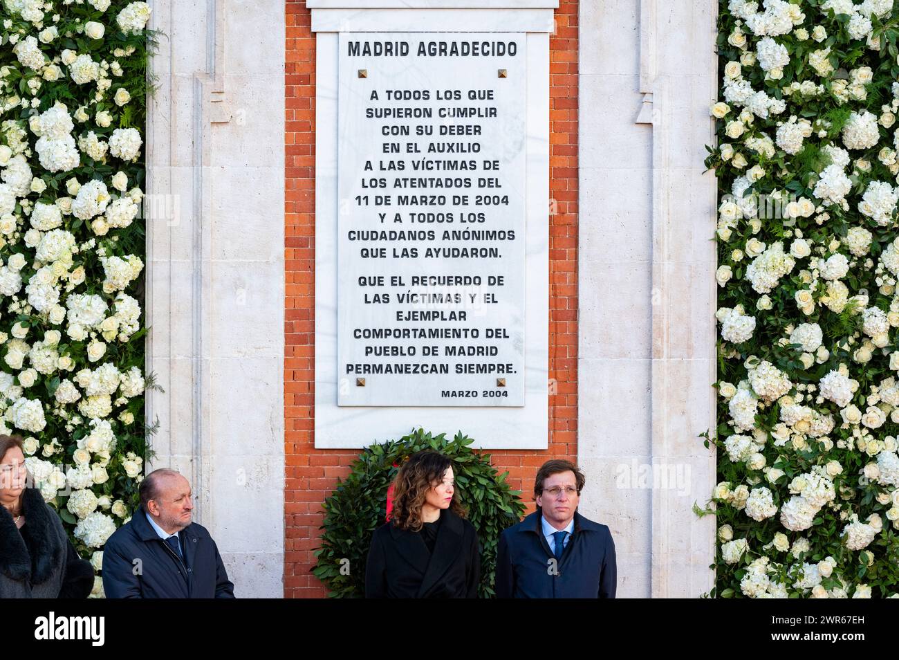 Madrid, Spain. 11th March, 2024. Isabel Diaz Ayuso (C), president of the Community of Madrid and leading figure of the PP, and Jose Luis Martinez Almeida (R), mayor of Madrid, seen during the celebratory act of remembrance of the twentieth anniversary of the 11M terrorist attacks. On the morning of 11 March 2004 (also known in Spain as 11M) there have been a series of simultaneous bombings against the Cercan'as commuter train system of Madrid. The explosions killed 193 people and injured around 2,050. Credit: SOPA Images Limited/Alamy Live News Stock Photo
