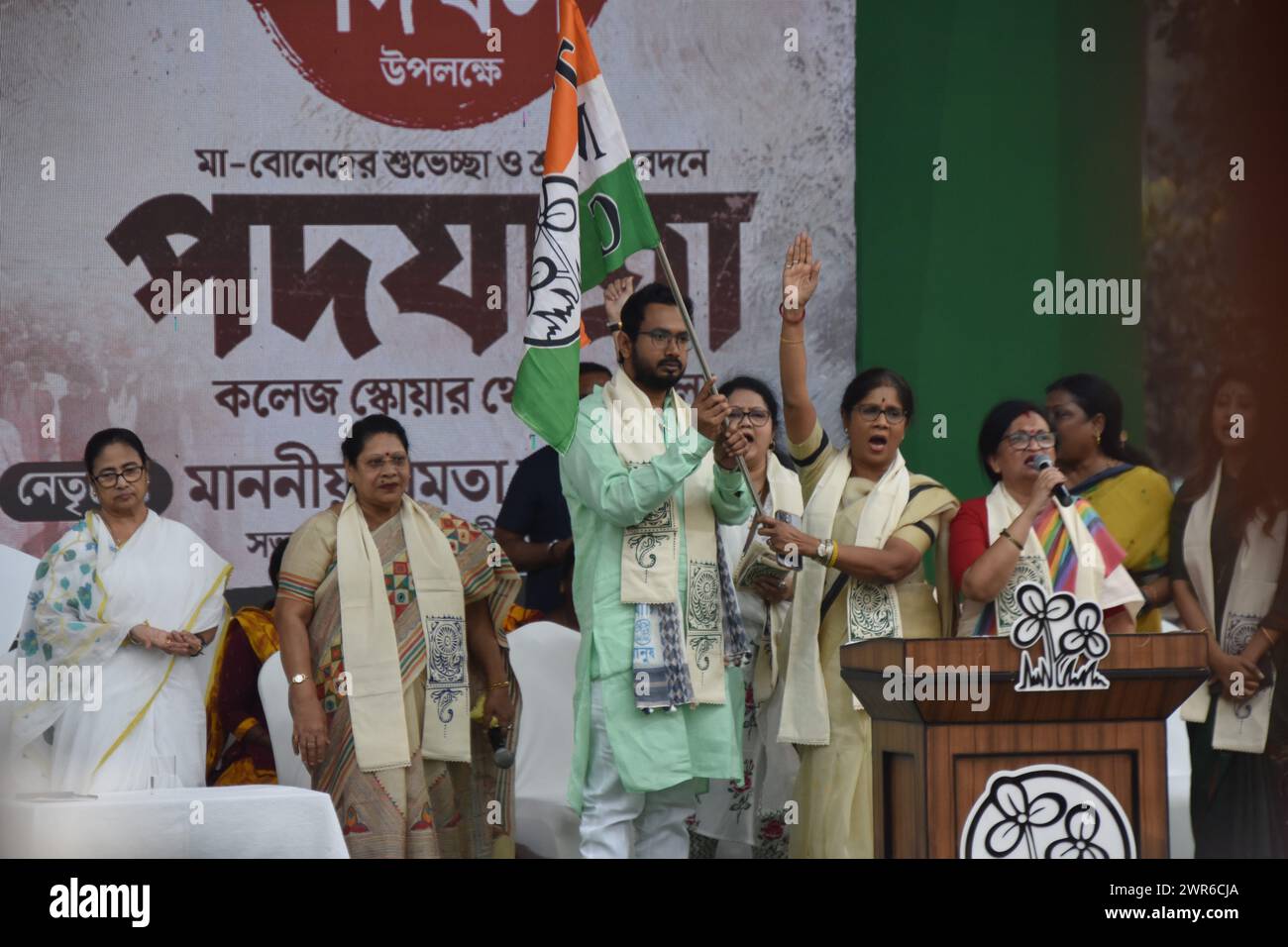 March 7, 2024, Kolkata, West Bengal, India: A BJP MLA changing his party to TMC by taking the TMV flag at the West Bengal Chief Minister and Trinamool Supremo Mamata Banerjee led a women's rally in Kolkata today, responding to Prime Minister Narendra Modi's criticism of the Trinamool Congress over the Sandeshkhali issue. Women from Sandeshkhali island, where allegations against local Trinamool leaders have emerged, also joined. The rally, themed ''Mahilader Adhikar, Amader Angikar'' (women's rights, our commitment), featured Banerjee leading a foot march, accompanied by prominent Trinamool lea Stock Photo