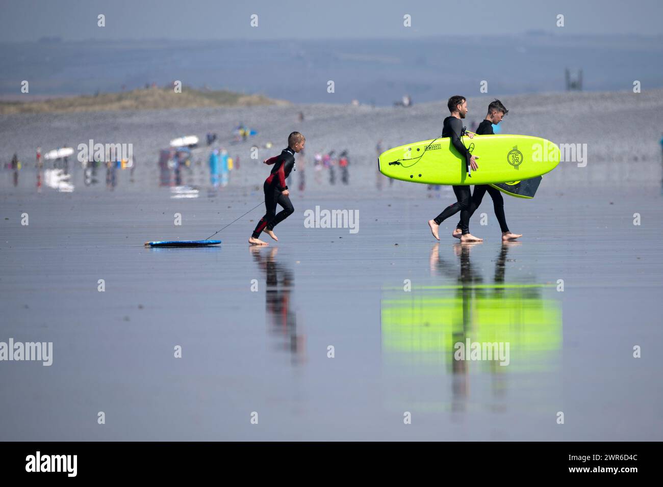 20/04/22   Surfers take advantage of warmer than expected weather on Westward Ho! beach, North Devon. Stock Photo