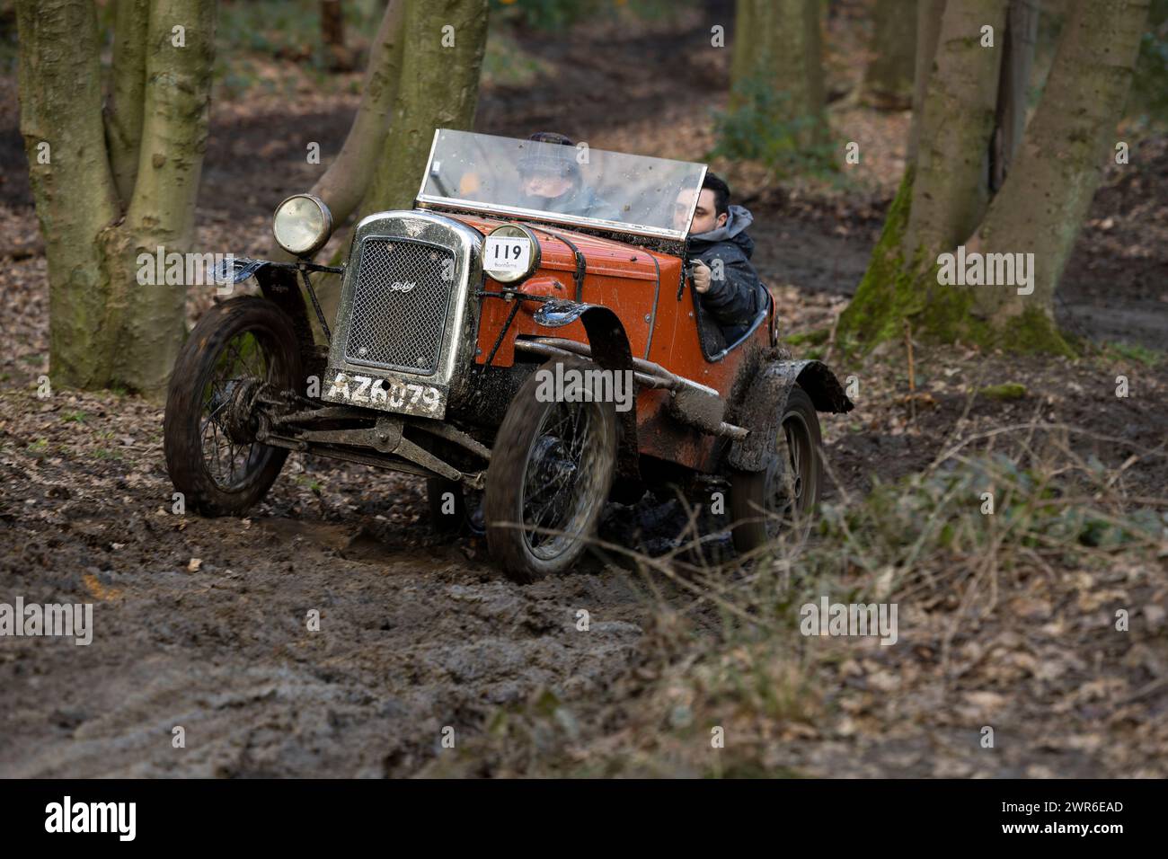 06/03/22   Sarah Skelton and passenger - Austin 7 Ulster.  Members of the Vintage Sports-Car Club attempt to find grip as they ascend a slippery climb Stock Photo