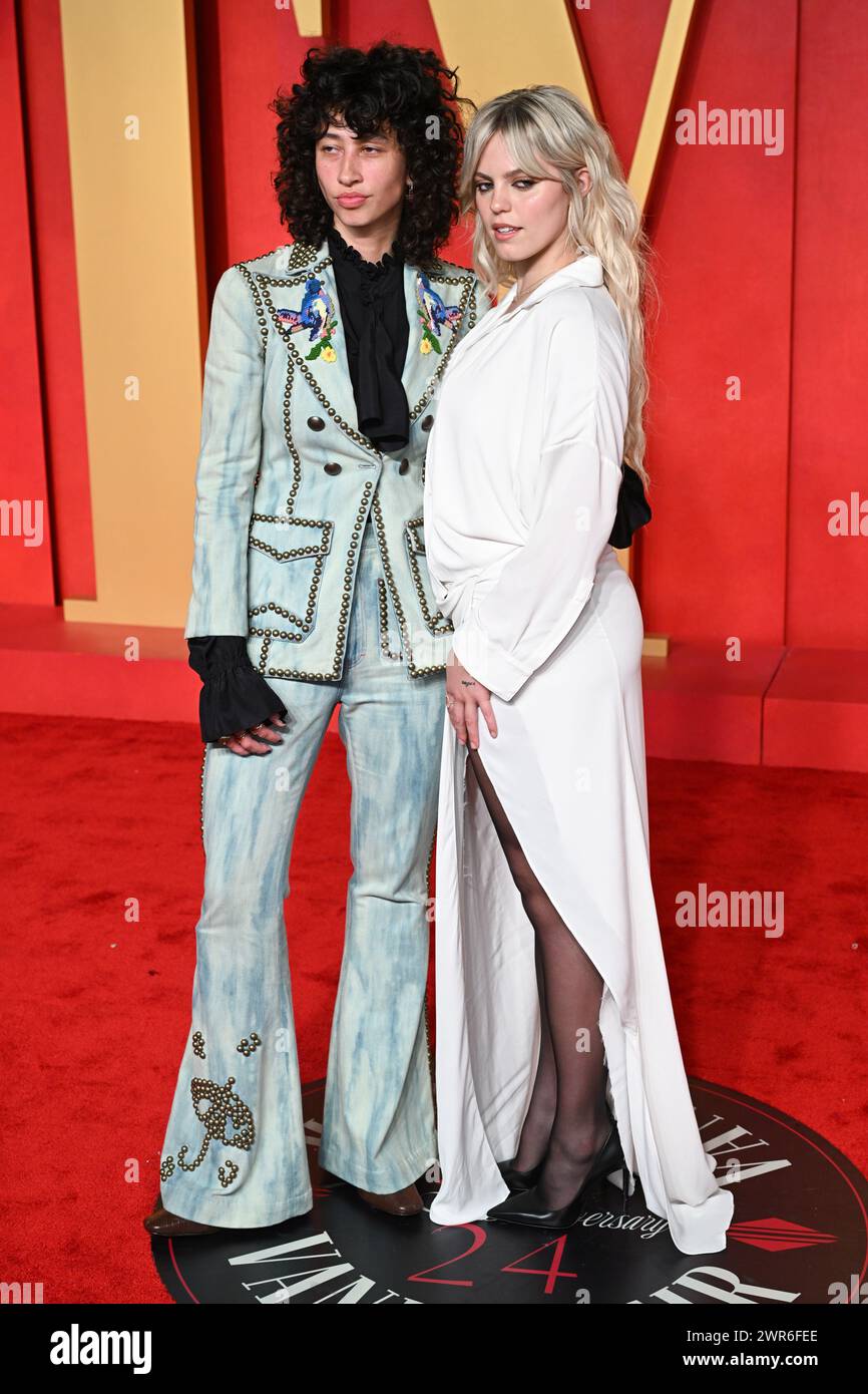 Los Angeles, USA. March 10th, 2024. Towa Bird and Renee Rapp arriving at the Vanity Fair Oscar Party, Wallis Annenberg Center for the Performing Arts. Credit: Doug Peters/EMPICS/Alamy Live News Stock Photo