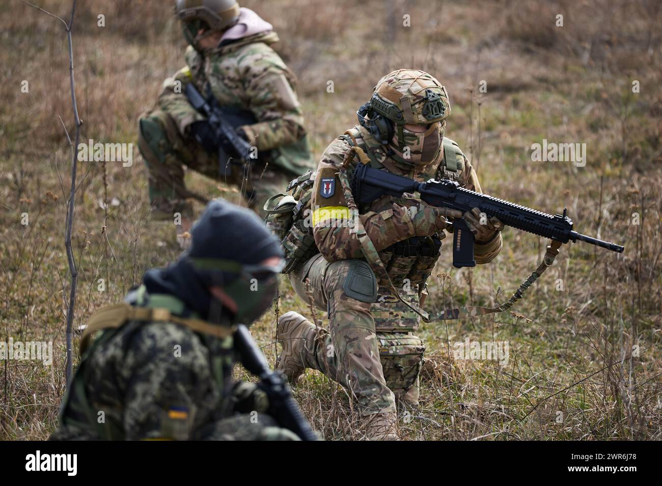 Ukrainian soldiers training with airsoft rifles on a military polygon ...