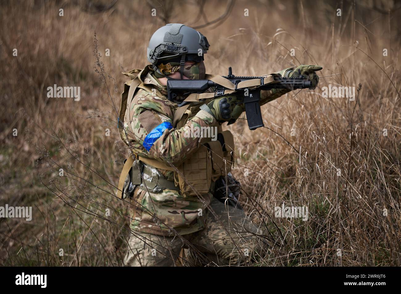 Ukrainian soldier training with airsoft rifle on a firing range. Kyiv ...
