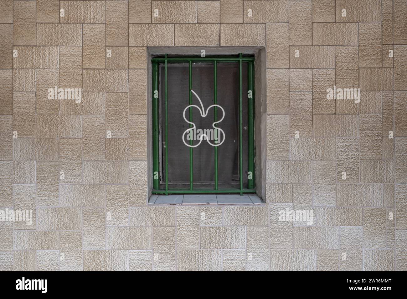 A small window with metal bars on the tiled wall Stock Photo - Alamy