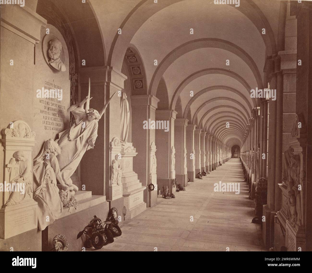 Sculpture gallery with funeral wreaths at the Staglieno cemetery in Genoa, Genova Camposanto Galleria (title on object), Part of French artist album., anonymous, Campo Santo, c. 1880 - c. 1900, paper, albumen print, height 218 mm × width 261 mm, photograph Stock Photo