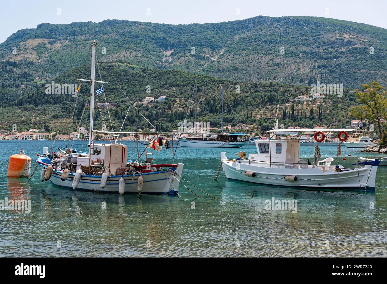 Traditional wooden fishing boats at the harbour of Vathy in Ithaka island, Greece Stock Photo