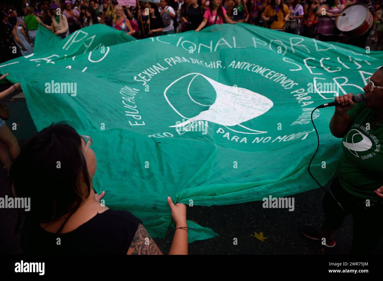 Buenos Aires, Argentina. 08th Mar, 2024. Women hold the green scarf, which stands for the feminist movement and the right to abortion, at an International Women's Day demonstration in front of the Argentinian Congress. Credit: Igor Wagner/dpa/Alamy Live News Stock Photo