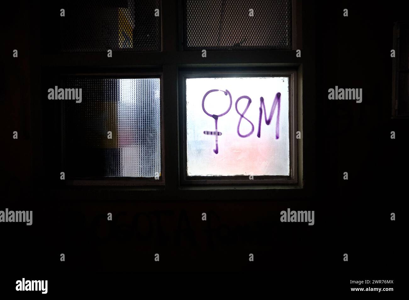 Bogota, Colombia. 08th Mar, 2024. A 8M graffiti is made on a lit window during the international women's day demonstrations in, Bogota, Colombia on March 8, 2024. Photo by: Chepa Beltran/Long Visual Press Credit: Long Visual Press/Alamy Live News Stock Photo