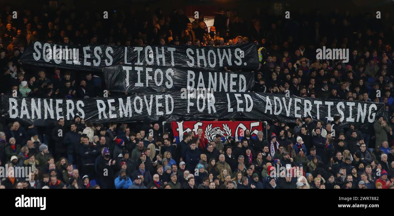 Crystal Palace fans hold aloft banners which read ‘Souless Light Shows ...