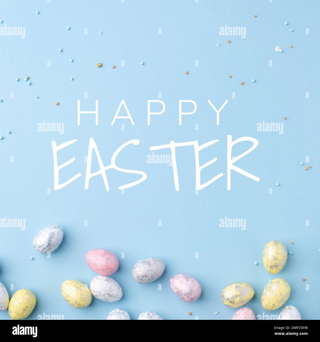 Festive Easter card. Multicoloured Easter eggs on a blue background. Stock Photo