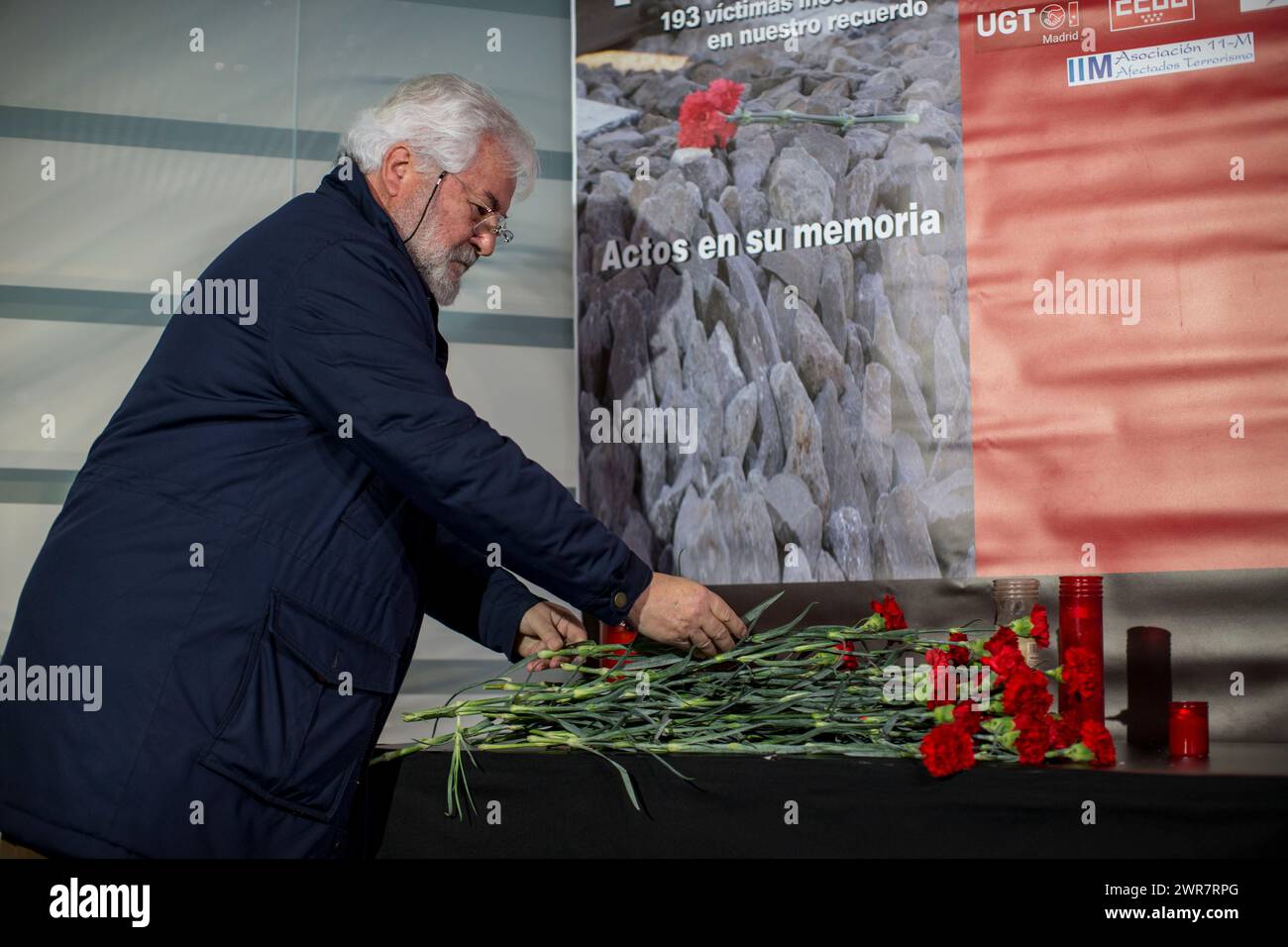 Madrid, Spain. 11th Mar, 2024. A man places a red carnation on an altar in front of a memorial to the victims of the train bombing inside the Atocha train station in Madrid, during the 20th anniversary of the terrorist attack. On March 11, 2004, several terrorist attacks occurred in Madrid, leaving 193 people dead and around 2,000 injured. Credit: SOPA Images Limited/Alamy Live News Stock Photo