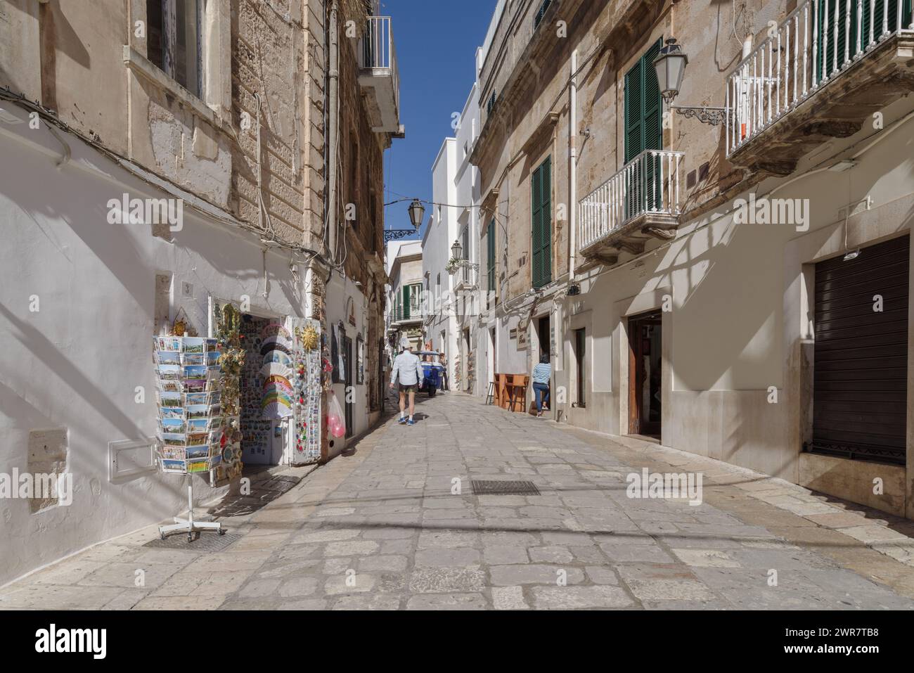 Street in the old town of Ostuni, also La Citta Bianca, The White Town, Itria Valley, Apulia region, Italy Stock Photo