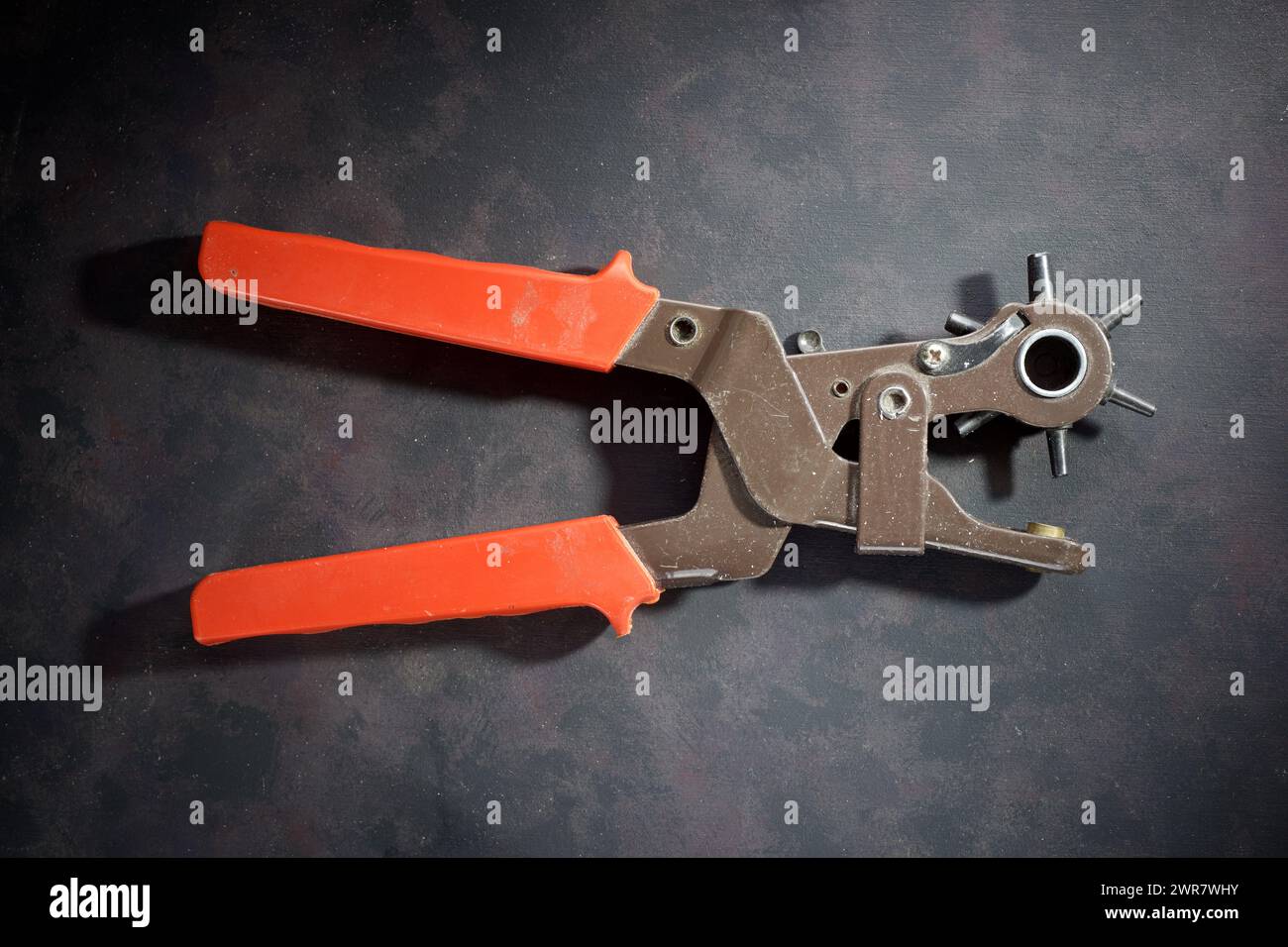 Tool leather hole belt punching hires stock photography and images Alamy