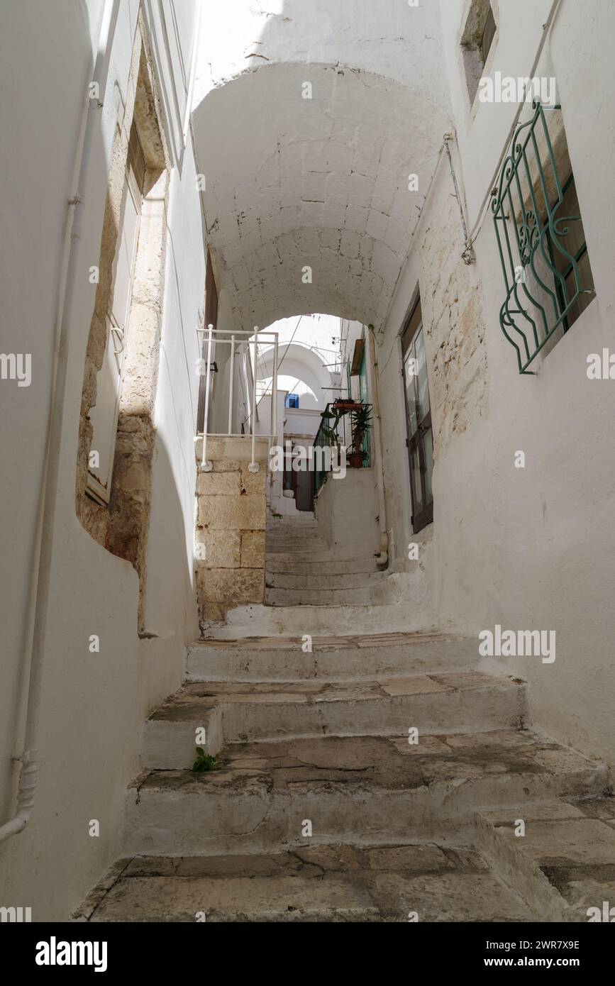 Narrow street in Ostuni old town, Apulia region, Italy Stock Photo