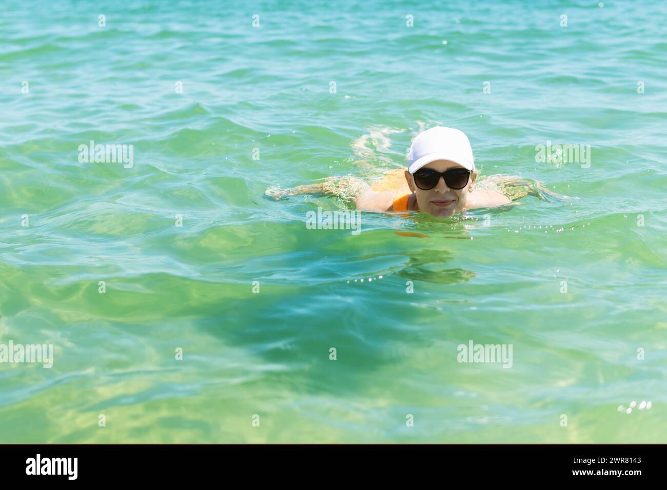 Woman swimming sea swim cap hi-res stock photography and images - Alamy