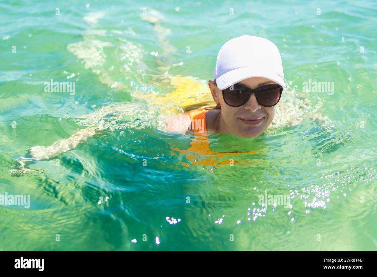 Woman swimming sea swim cap hi-res stock photography and images - Alamy