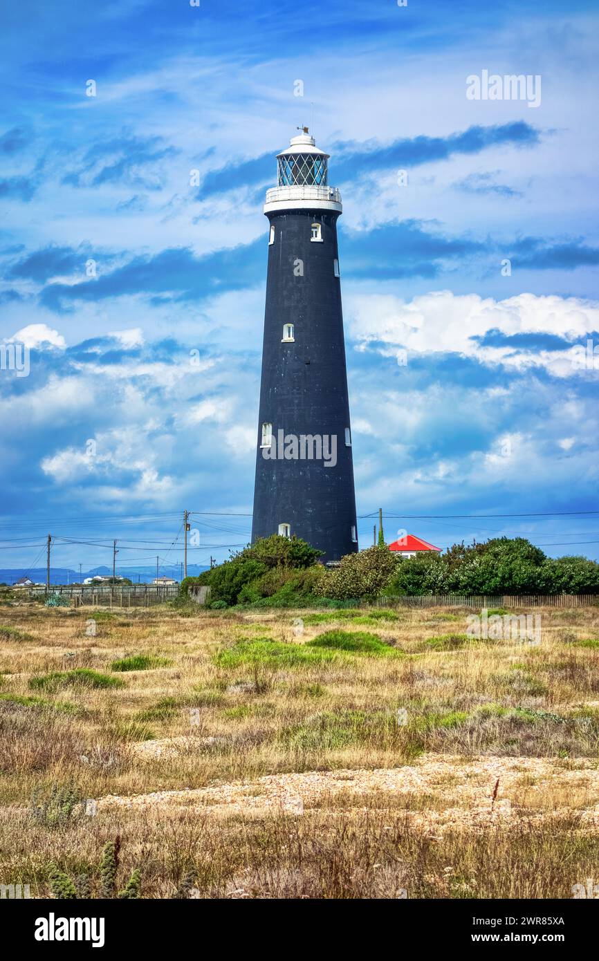 The Old Lighthouse, Dungeness, Kent, with a dramatic dark blue sky Stock Photo