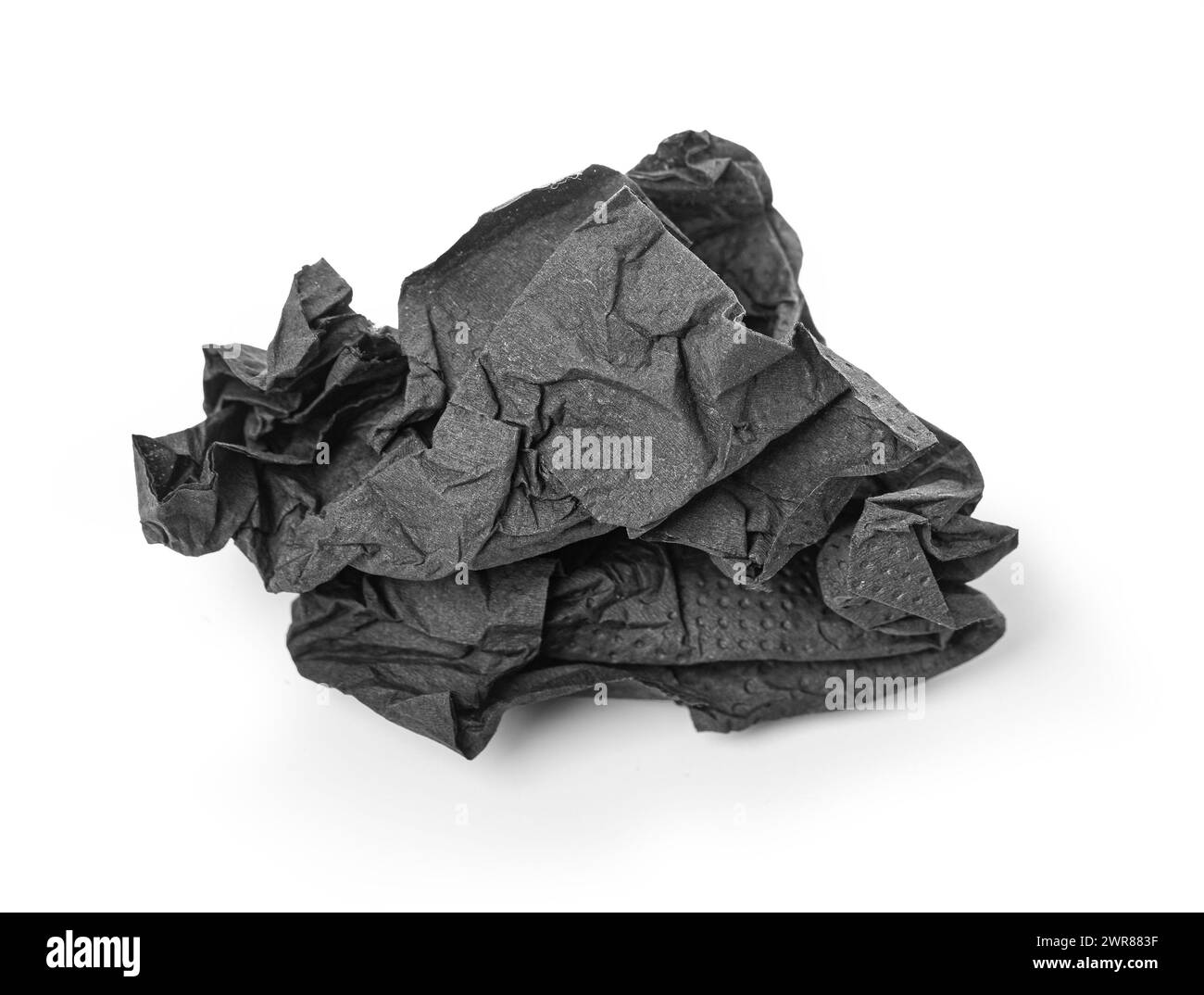 Crumpled black paper napkin - unused, isolated on white Stock Photo