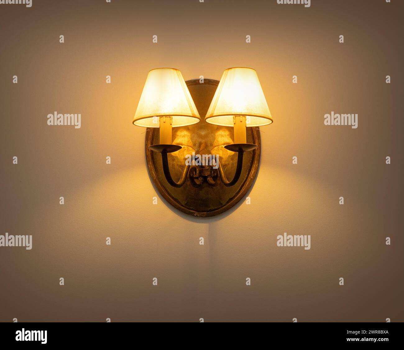 Wall lamp with yellow shade from canvas Stock Photo