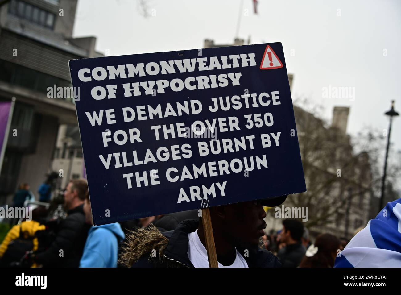 Westminster Abbey, LONDON, ENGLAND, MARCH 11 2024. Southern Cameroons protest against the Monarchy and the British Government 'Stop divided us Cameroons' at the Commonwealth Day celebrations. Cameroons are entitled to independence from British colonial law and to govern themselves without being told what and how to govern. The strangest thing is that the all Commonwealth head of state hates the British colony and is proud to bow and kneel to British colonial annually as a celebrations of Commonwealth colonasation, when they come to London. So-called independent nation, they still love to be Br Stock Photo