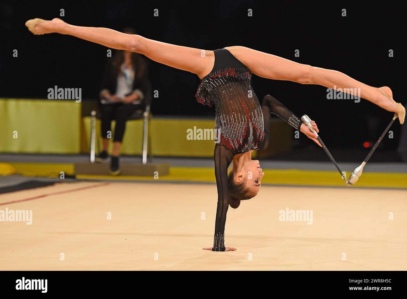 gymnast perform at rhythmic gymnastics competition Stock Photo