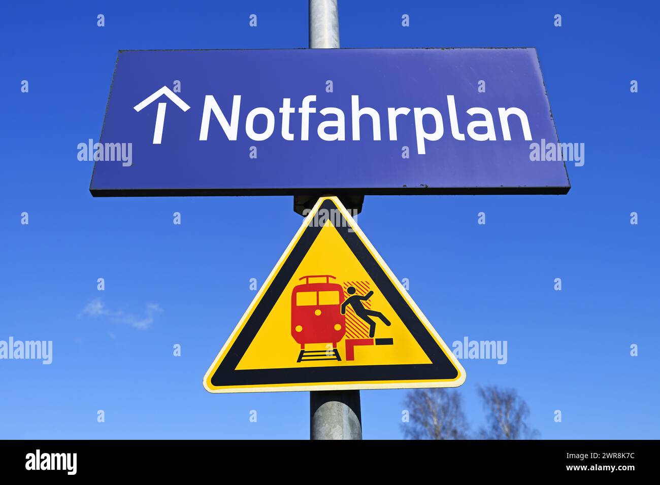 Signpost On The Platform With Emergency Timetable, Photomontage Stock Photo